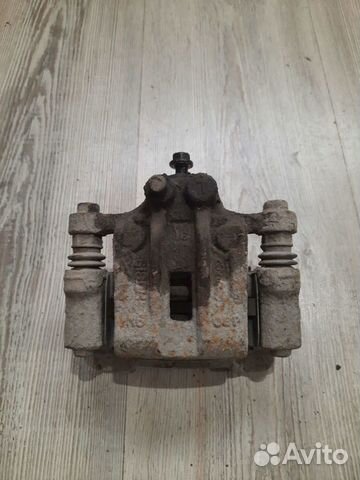 Суппорт тормозной задний Kia sportage 3 Лев