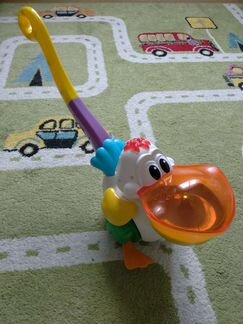 Свето-музыкальная игрушка каталка