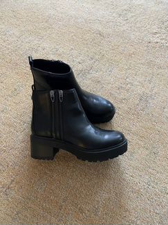 Новые кожаные ботинки