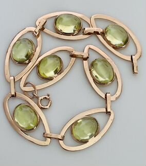 Золотой браслет с хризолитами